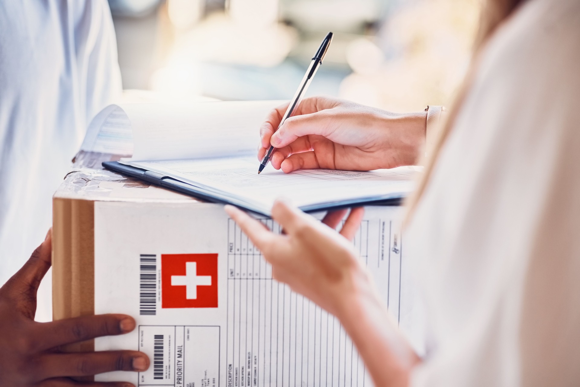 Delivery, signature and box parcel for a customer for an online order or ecommerce medicine shopping. Cargo, shipping and courier driver giving a medical package to a woman for signage at front door.